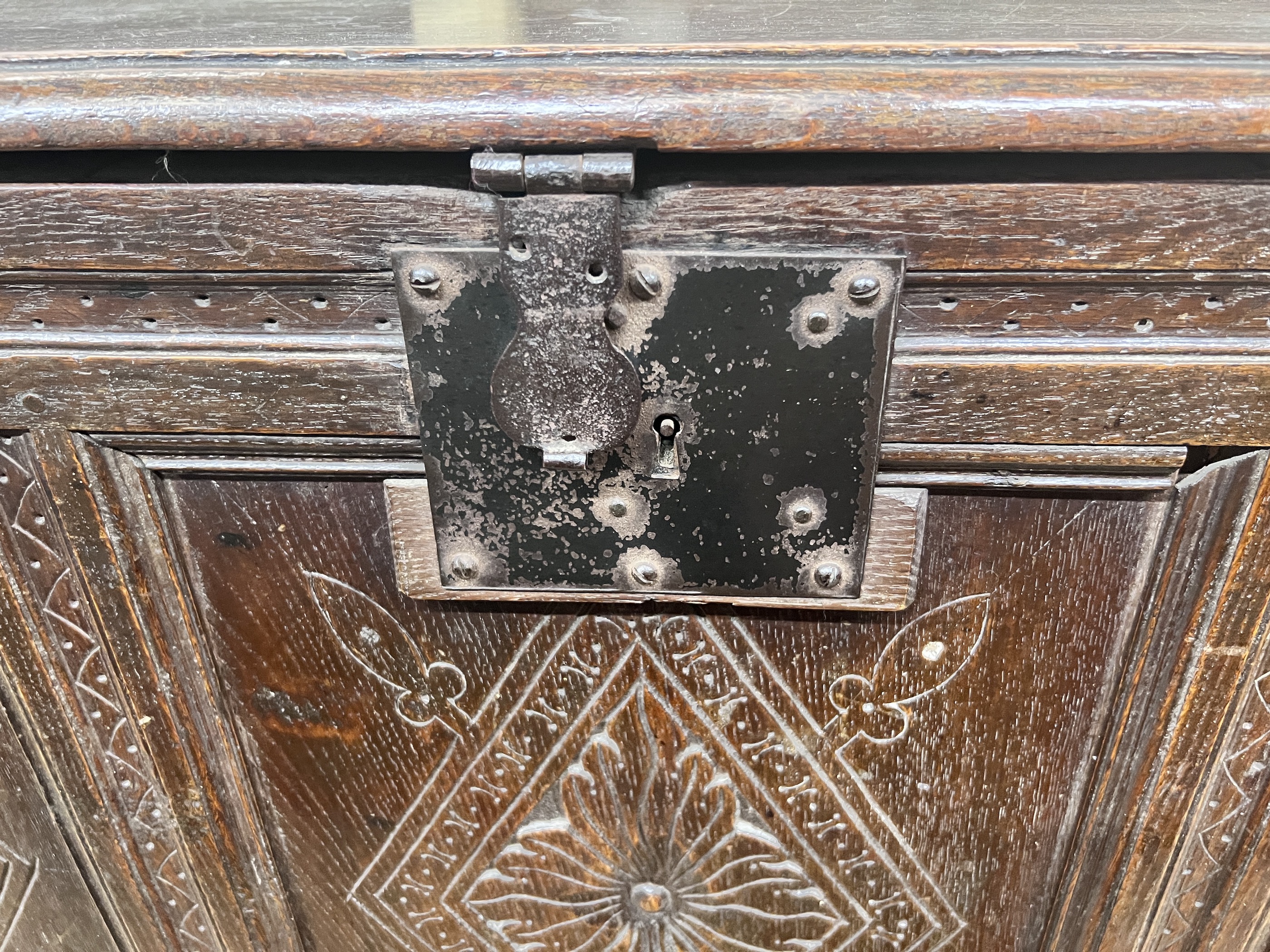 An 18th century carved oak coffer, length 133cm, depth 57cm, height 83cm